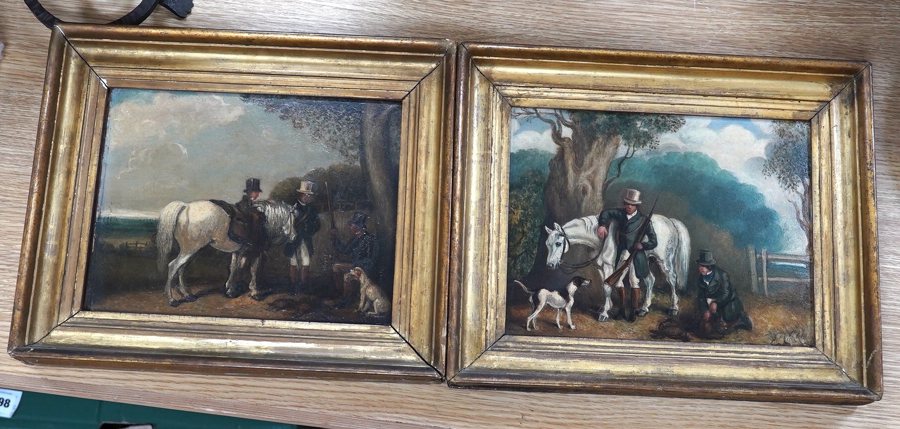 Early 19th century, naive English School, pair of oils on board, Huntsman, horses and hounds before landscapes, unsigned, one with indistinct label verso, 19 x 24cm, gilt frame. Condition - poor to fair